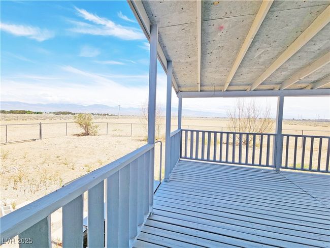 Deck with a mountain view and fence | Image 29