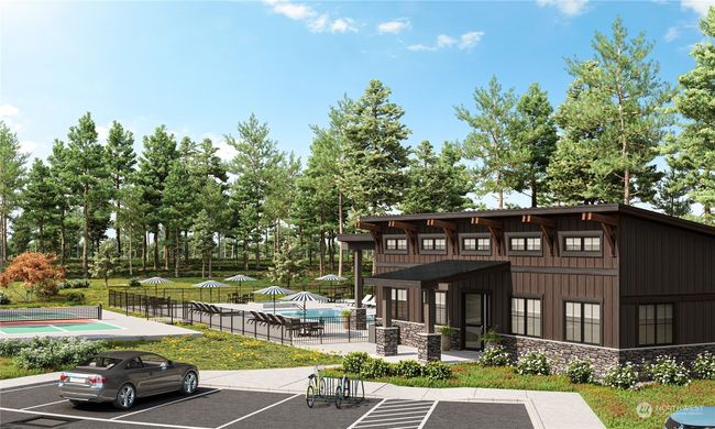 The Uplands 55+ clubhouse with it's own pool, amenities, and pickleball court. | Image 35