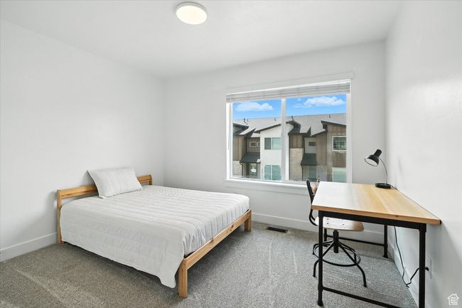 Bedroom featuring carpet floors and an office area | Image 18