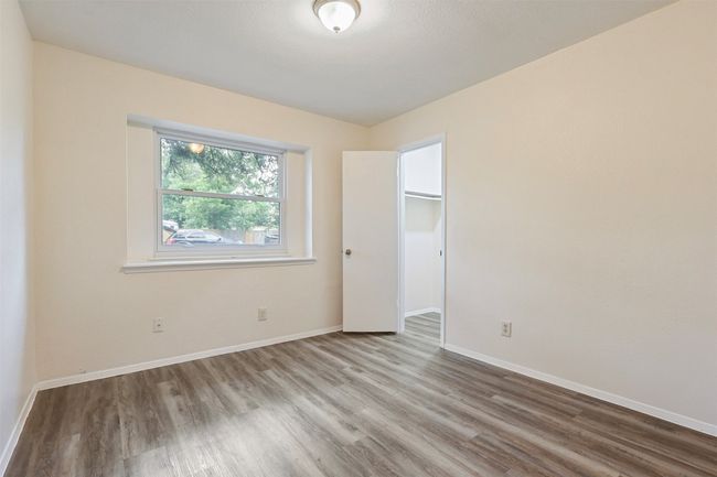 Bedroom 3 also faces front and has a great walk-in closet. | Image 19