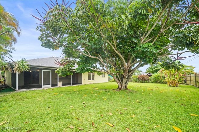 View of yard featuring a sunroom | Image 29