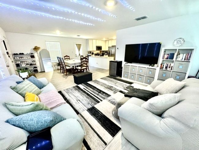 Living area with light wood-style flooring | Image 9