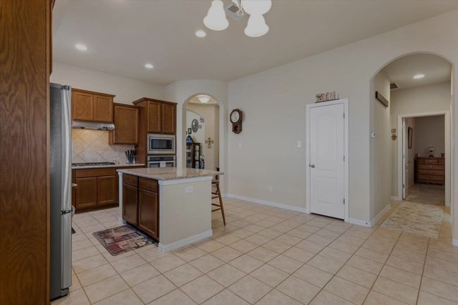 The kitchen from the corner of the dining area. | Image 8