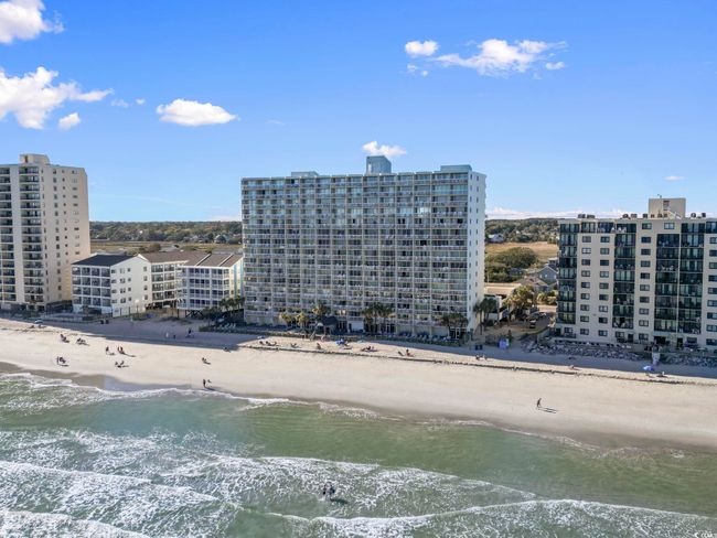 Drone / aerial view with a water view, a view of city, and a beach view | Image 5