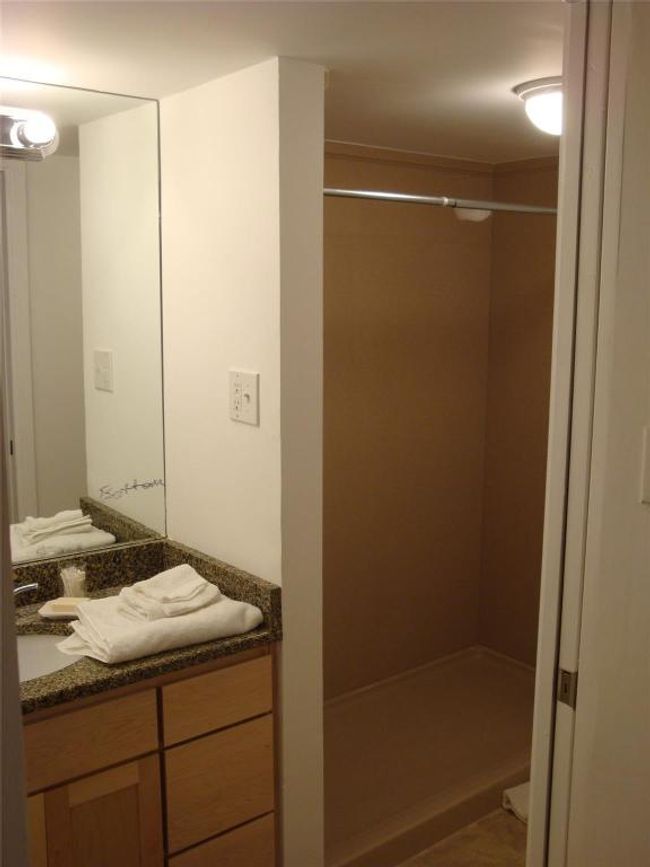Bathroom with a shower stall and vanity | Image 4