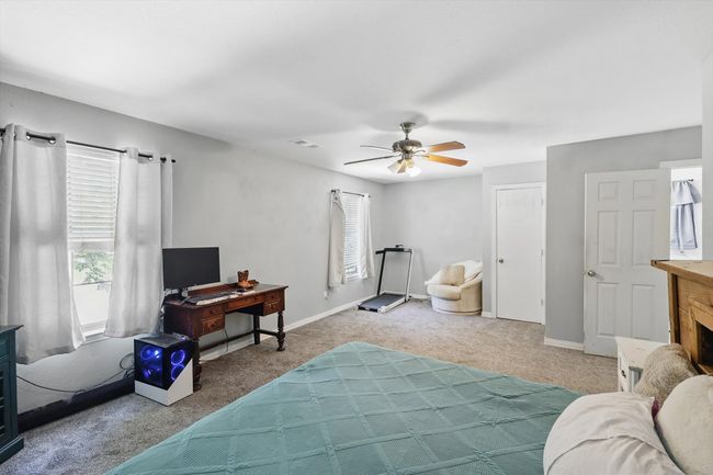 Bedroom featuring carpet flooring and a ceiling fan | Image 16