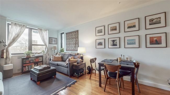 Living area with wood finished floors | Image 5
