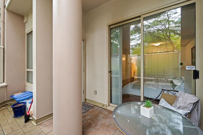 Doorway to outside featuring brick patterned floors and baseboards | Image 15