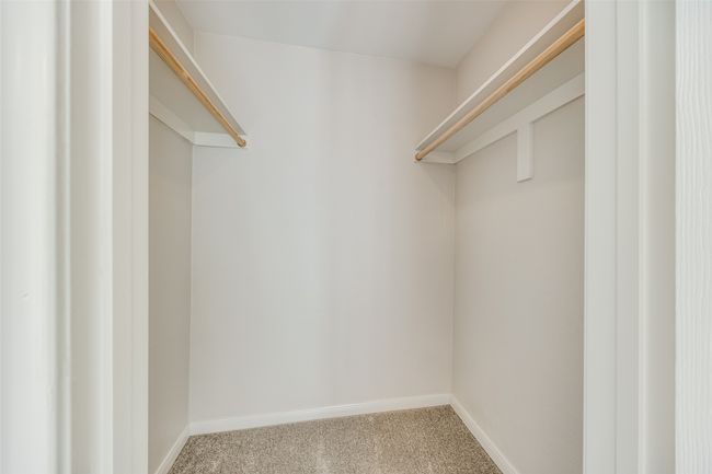 Walk in closet featuring carpet flooring | Image 17