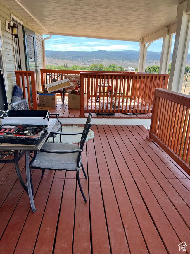 Wooden deck with a mountain view | Image 9