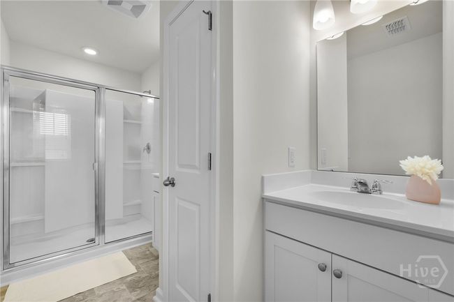 Walk in shower and linen closet that separates the vanity areas. | Image 44