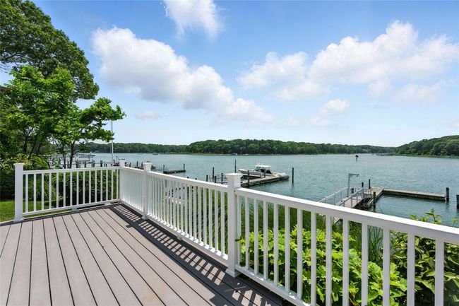 Deck with a dock and a water view | Image 7