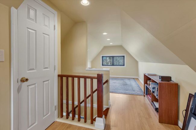 Additional living space featuring lofted ceiling and light wood-type flooring | Image 21