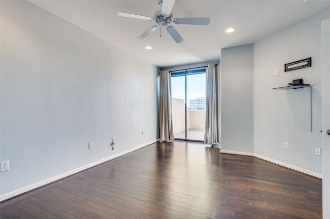Unfurnished room featuring ceiling fan and dark hardwood / wood-style flooring | Image 13