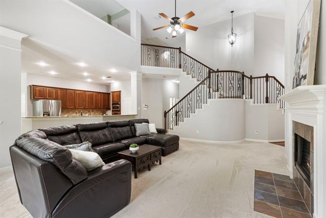 Split staircase with entry located in foyer or family room adjoining at landing to continue to 2nd floor. | Image 12