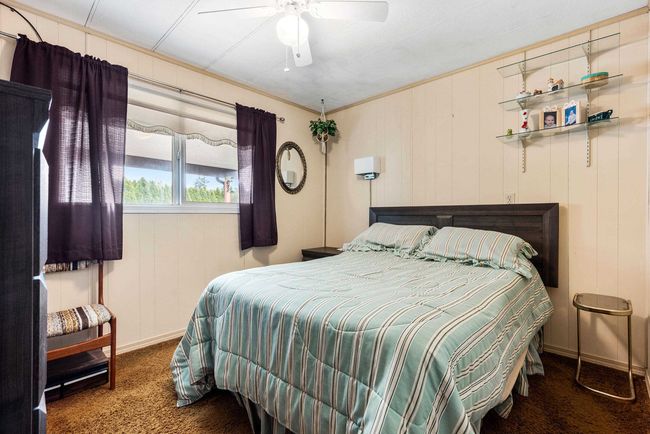Carpeted bedroom featuring baseboards and ceiling fan | Image 20