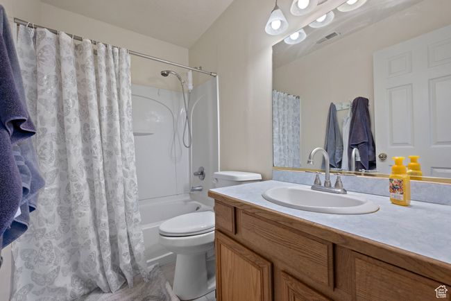 Bathroom with vanity and shower / bath combo with shower curtain | Image 19