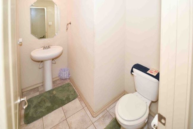 Bathroom featuring tile patterned flooring and toilet | Image 15