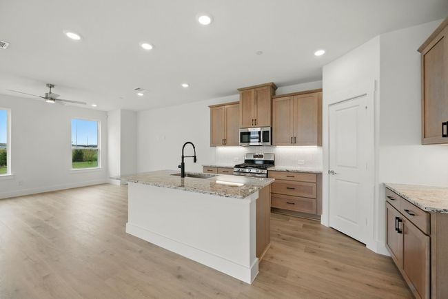 This fantastic home features an open concept design perfect for entertaining family and friends! | Image 6