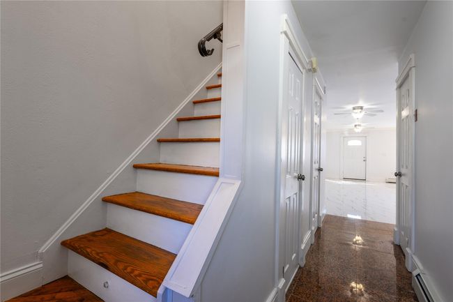 Stairway and entryway featuring wood floors | Image 4
