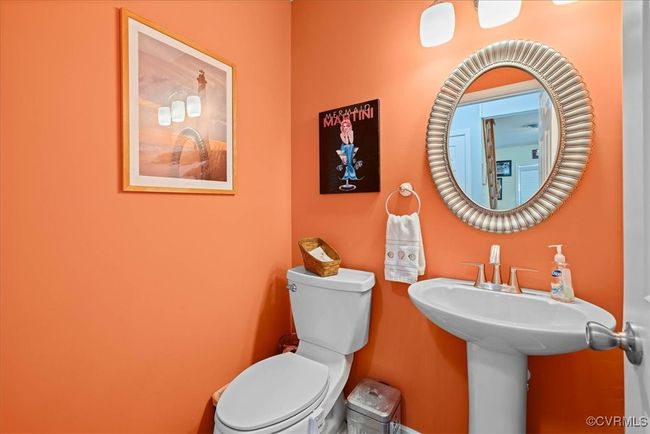 Powder room located off of kitchen/ dining room area. Great for guests when entertaining. | Image 17