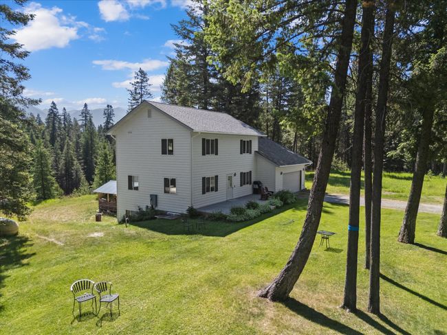 View of home's exterior with a yard | Image 43