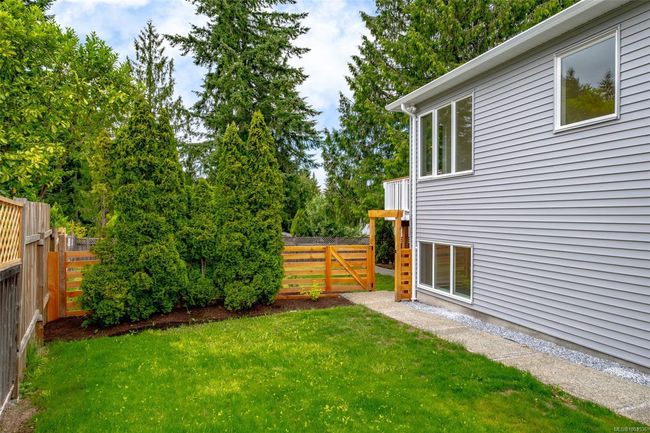 Side yard and walkway to downstairs entrance | Image 57