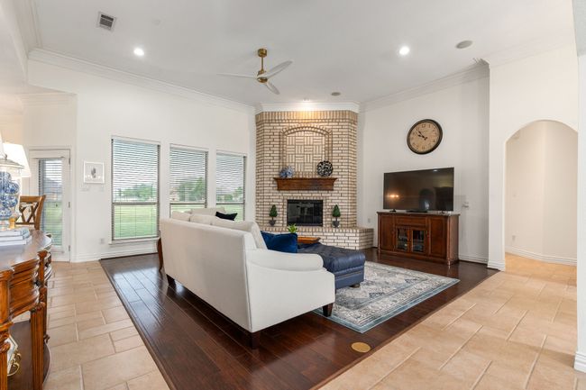 Corner woodburning fireplace with decorative brick accents | Image 6