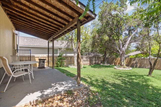 Fenced backyard featuring a patio | Image 10