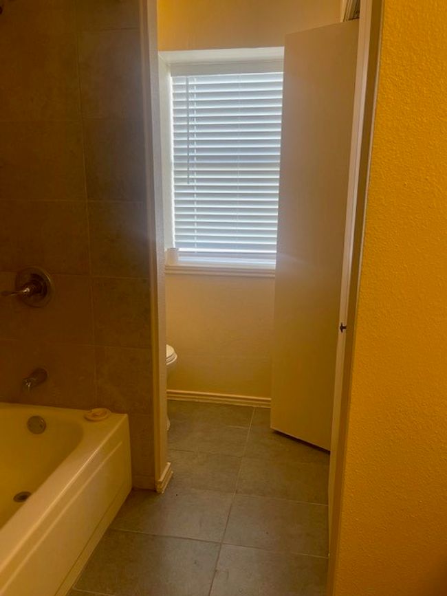 Hall bathroom with washer-dryer closet for full size units. | Image 15