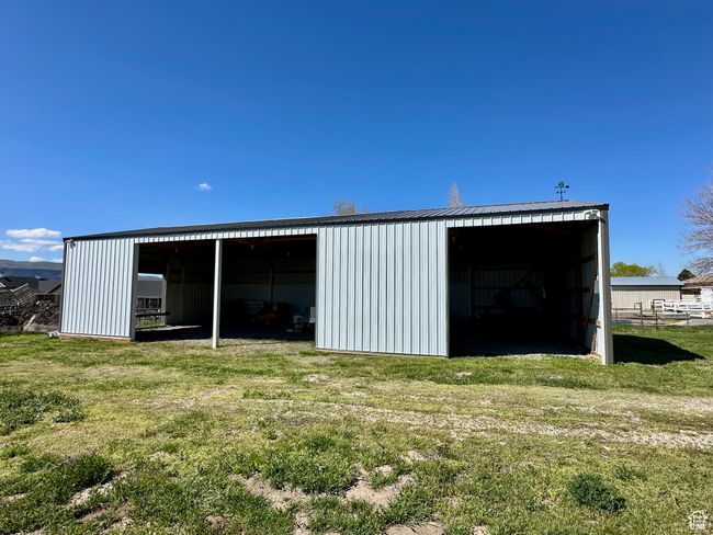 View of outbuilding with a lawn | Image 8