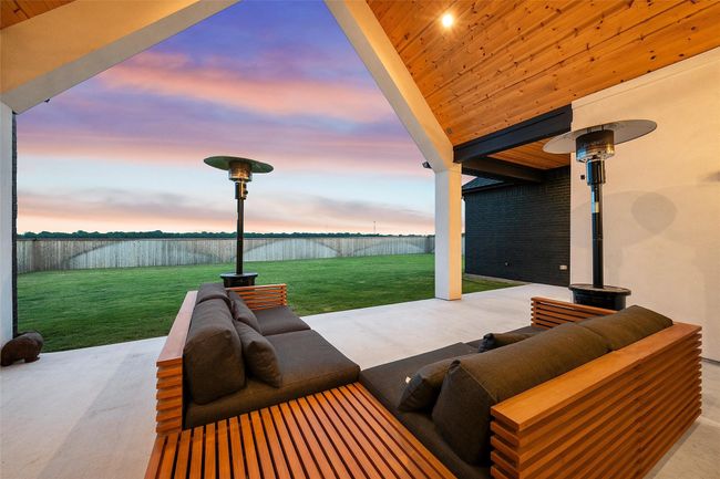 Patio terrace at dusk with outdoor lounge area and a lawn | Image 36