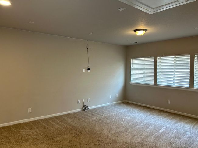 Spare room featuring carpet floors and baseboards | Image 21