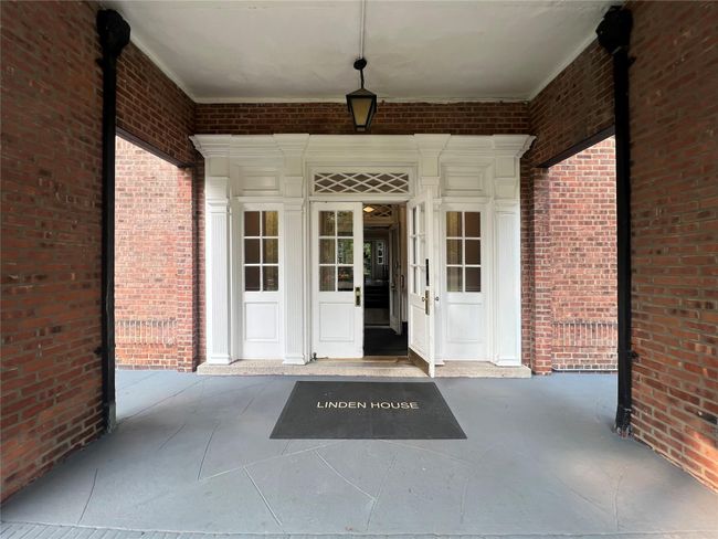 View of exterior entry with brick siding | Image 20