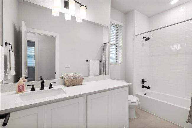 Bathroom with vanity and washtub / shower combination | Image 20