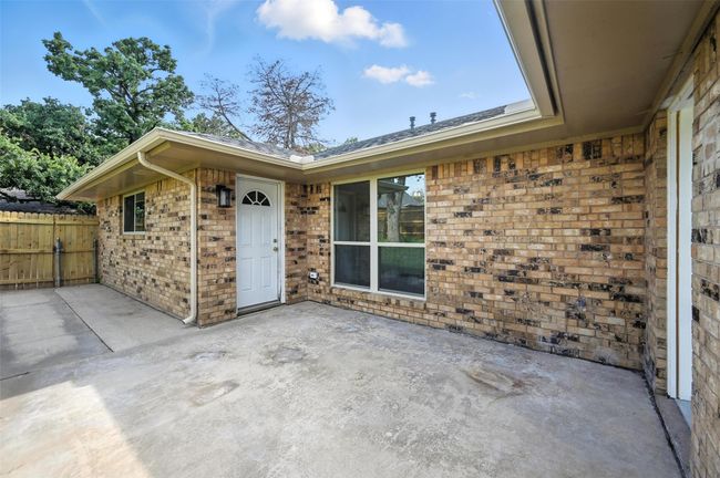 Patio has plenty of room for outdoor furnture as we all a a convient door that lead to the garage. | Image 23