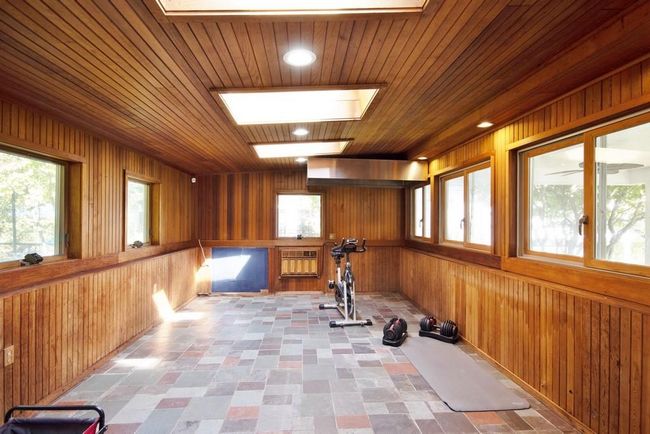 Paneled Room off Kitchen has 3 skylights and A-C wall unit | Image 9