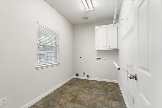 Spacious laundry room that can be used as additional storage. | Image 34