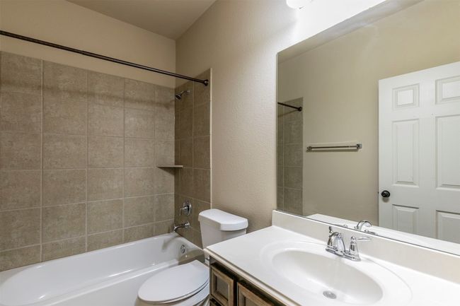 Bathroom 4 with toilet, vanity, and tub / shower combination | Image 34