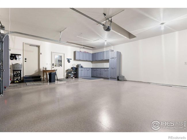 Large 2-Car Attached Garage with Coated Floors and Cabinets for Storage. Not shown Floor to Ceiling Cabinets, perfect for Kitchen Pantry Items. Large Attic above Garage for Storage. | Image 36