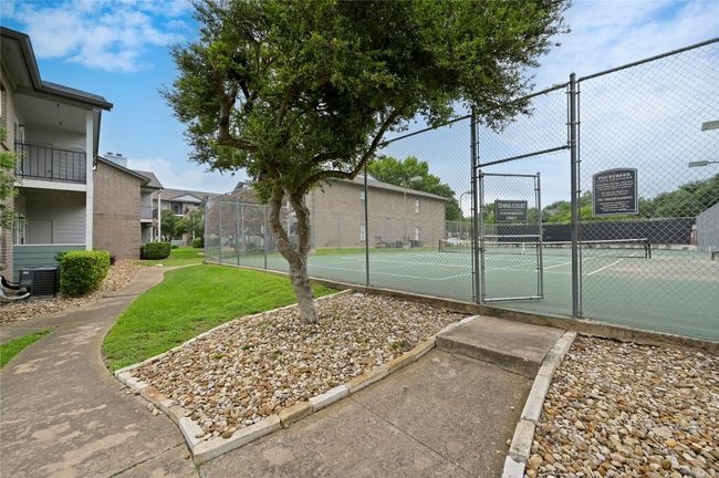 View of tennis court with a gate | Image 19