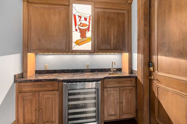Indoor wet bar featuring beverage cooler | Image 28