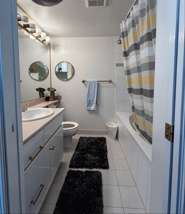 Bathroom featuring toilet, tile patterned floors, vanity, and visible vents | Image 9