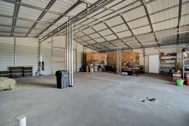 Garage with a workshop area | Image 28