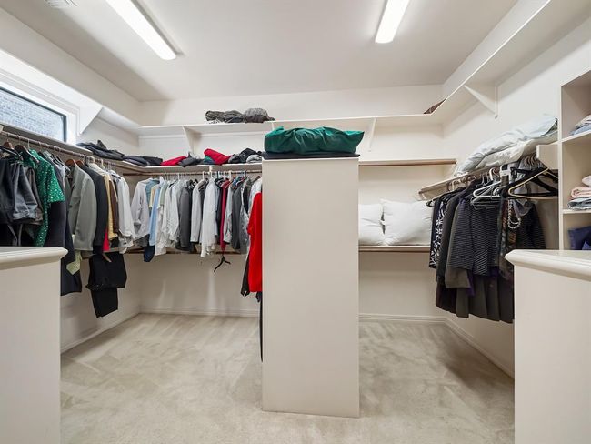 Expansive walk-in closet with ample storage and organization space. | Image 29