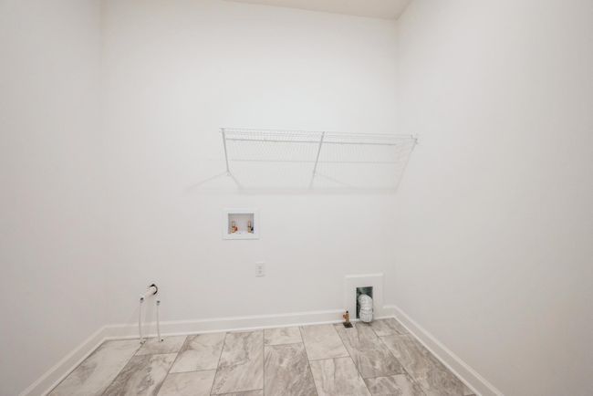 Photo of actual home. Enjoy main level laundry! | Image 14