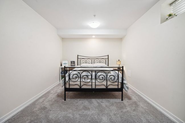 Carpeted bedroom with baseboards | Image 33