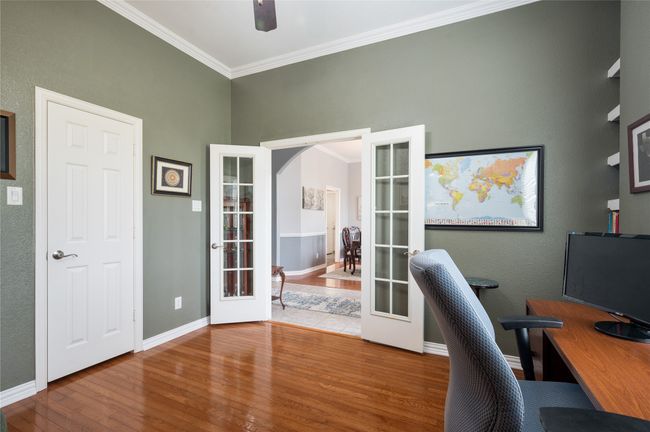 Office with french doors, wood finished floors, crown molding, and ceiling fan | Image 14