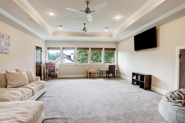 Flexible use as a TV room or study room. | Image 35