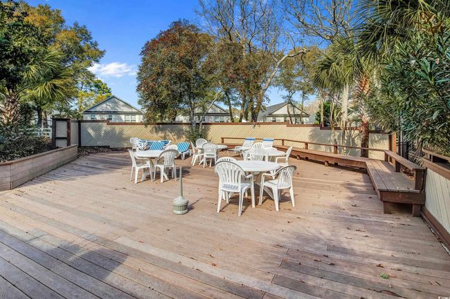 Deck with outdoor dining space and a fenced backyard | Image 33
